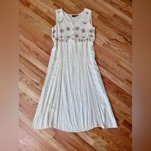 Elegant tie back White Dress with clover embroidered design